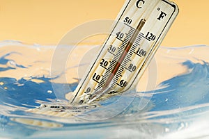 Climate change concept, thermometer immersed in water