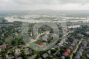 Climate change and the effects of global warming. Flooded village, farms and fields after heavy rains. Environmental