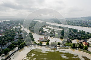 Climate change and the effects of global warming. Flooded village, farms and fields after heavy rains. Environmental natural