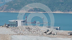 Climate change emergency. Landfill tip causes environmental destruction on Coast In Hongkong - dron