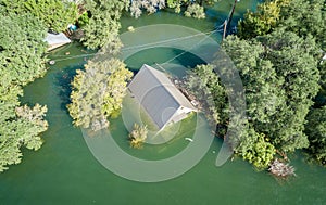 Climate Change Flooding with a House Under water photo