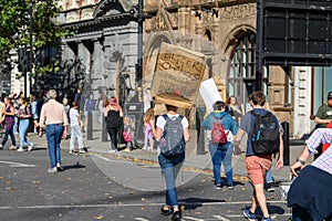 Climate Change protester holding a homemade protest sign at an Extinction Rebellion march