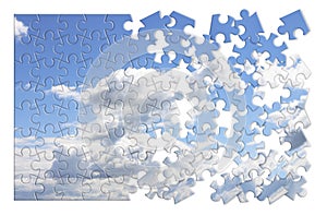 Climate changes concept image with a cloudy sky in puzzle shape