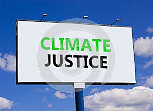 Climate justice symbol. Concept words Climate justice on beautiful big white billboard. Beautiful blue sky cloud background.