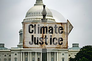 Climate Justice text on a banner outside the Capitol in washington dc Generative AI