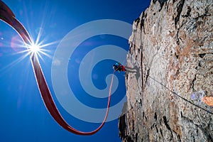 Climber abseiling the steep rock