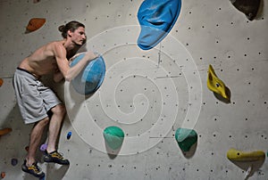 Climber in action, concentration before a difficult jump