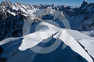 Climber ascending arete in way up to Aiguille du Midi