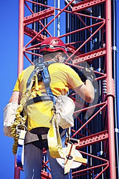 Climber ascending the cellular tower