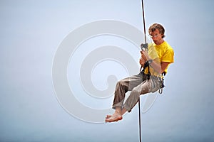 Climber belaying and being pulled up other climber