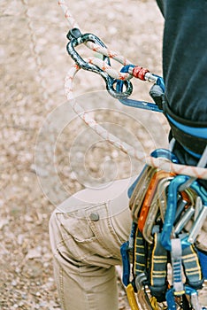 Climber belaying with rope safety system.