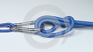 Climber carabiner knot tying