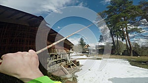 Climber checks the reliability of the system for felling of wood POV