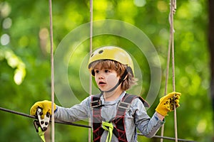 Climber child on training. Toddler age. Kids boy adventure and travel. Early childhood development. Toddler kindergarten