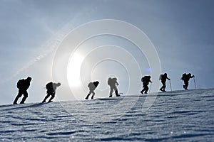 Climber climbing group winter activities & mountaineering