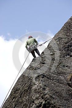 Climber climbing on a rock