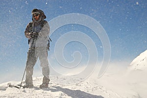 Climber facing wind and snow