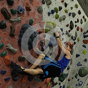 Climber flagging packed wall photo