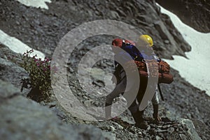 Climber with full pack on Eldorado Peak