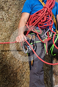 Climber holding red climbing rope