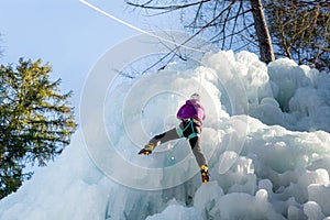 Climber with ice climbing equipment
