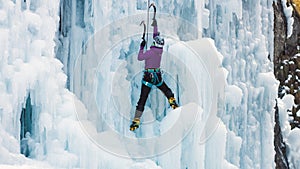 Climber with ice climbing equipment