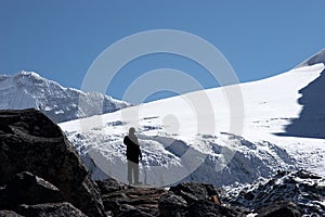 Climber looking at mountain slope, Himalaya, Nepal