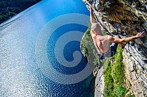 Climber man above the Lake