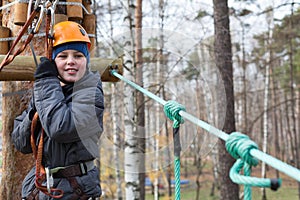 Climber is ready to the passage the ropes course