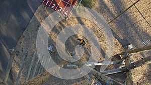 Climber with a safety line is lowered from the climbing tower