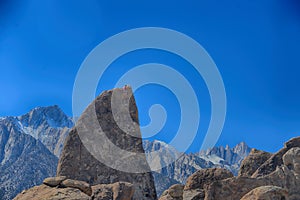 Climber on sharks fin arete route with mount whitney