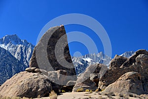 Climber on sharks fin arete route with mount whitney photo