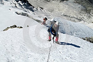 Climber on snow alpinist route
