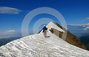 Climber on snow alpinist route