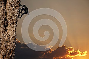 Climber on sunset on the rock