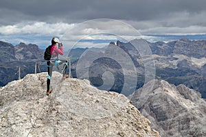 Climber taking photos on Ivano Dibona via ferrata