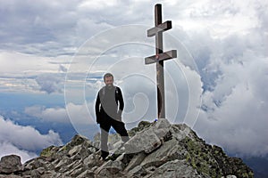 Climber on top of Krivan Peak