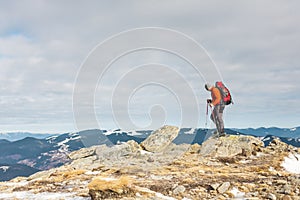 The climber on the top of the mountain.