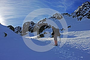 Climber trekking through snow