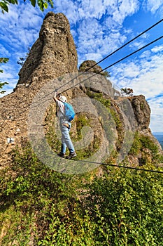 Climber on via ferrata bridge photo