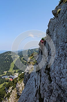 Climber in wall of Heli - Kraft - Klettersteig, Hochkar