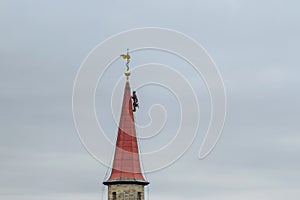 A climber is working of the tower