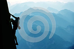 Climber on mountain range background