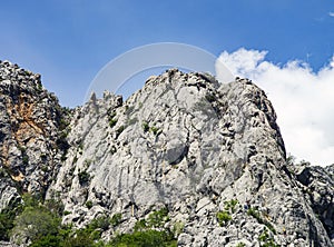 Climbers are climbing a rocky mountain in Paklenica, Croatia