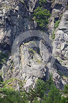 Climbers on famous Raven Crag photo