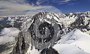 Climbers on French Alps viewed from Aiguille du Midi, France