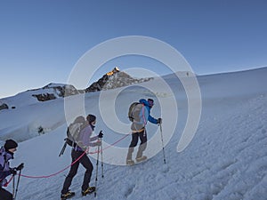 Climbers on Monte Rosa behind Lyskamm peak, Monte Rosa, Alps, It