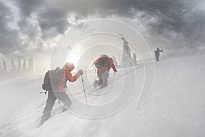 Climbers in mountain snowfall