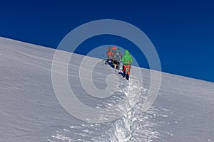 Climbers in a queue standing in a line in Himalayan ascent