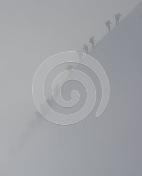 Climbers in snowstorm